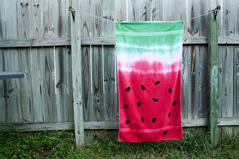 Image of a towel dyed red and green to look like a watermelon